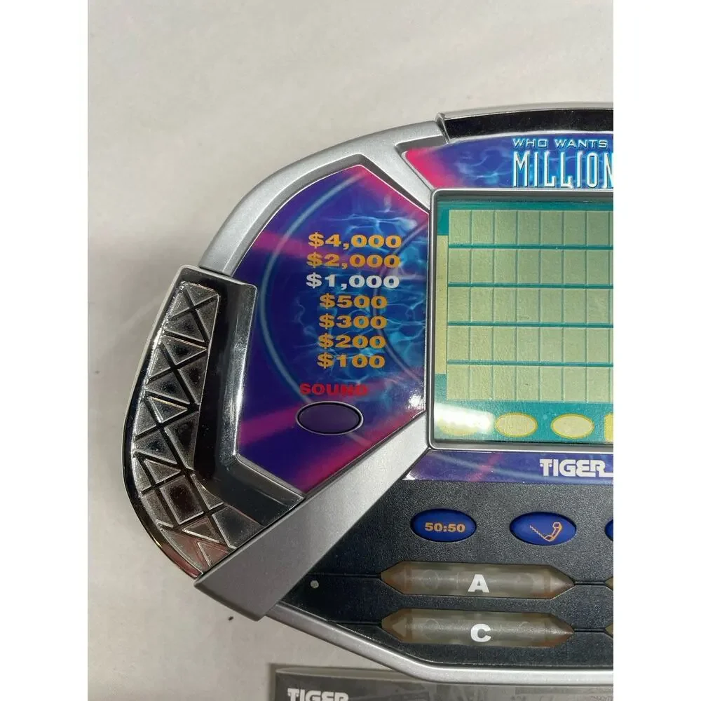 TIGER WHO WANTS TO BE A MILLIONAIRE HAND HELD GAME W/ CARTRIDGE & Manual Works